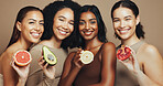 Skincare, fruit and portrait of women in studio for beauty, wellness and organic products. Spa, dermatology and group of people with food for cosmetics, natural benefits and glow on brown background