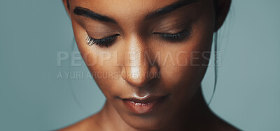 Buy stock photo Beauty, face and relax with Indian woman on studio background for makeup or cosmetic benefits. Aesthetic, eyelashes and eyeshadow with serious model person closeup for calm or cosmetology results