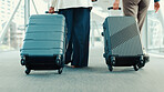 Legs, people, walk and suitcase at airport for travel, international flight and work trip. Back, staff and luggage in lobby for airplane transport, leaving airline and boarding gate of global journey