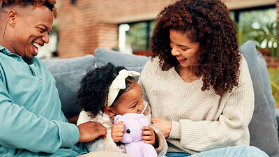 Buy stock photo Happy family, playing or child with teddy bear on sofa for bonding, laughter or interaction in home. Mom, dad and tickling with kid or daughter for playful childhood or affection together in house