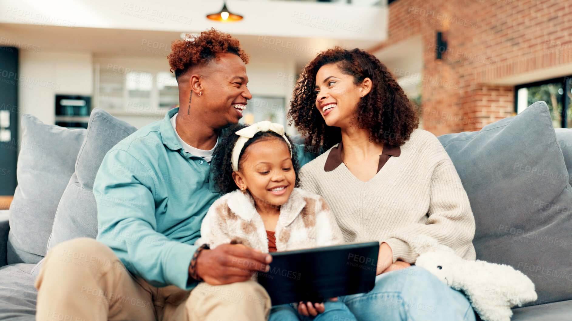 Buy stock photo Happy family, child or entertainment with tablet on sofa for online streaming or interaction in home. Mom, dad and kid with technology, smile or laughing for comedy movie, humor or bonding in house