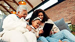 Mom, grandma and girl on couch with tablet, happy and low angle with movie, care and bonding. Senior woman, mother and child with app, streaming or film subscription for generations in family home