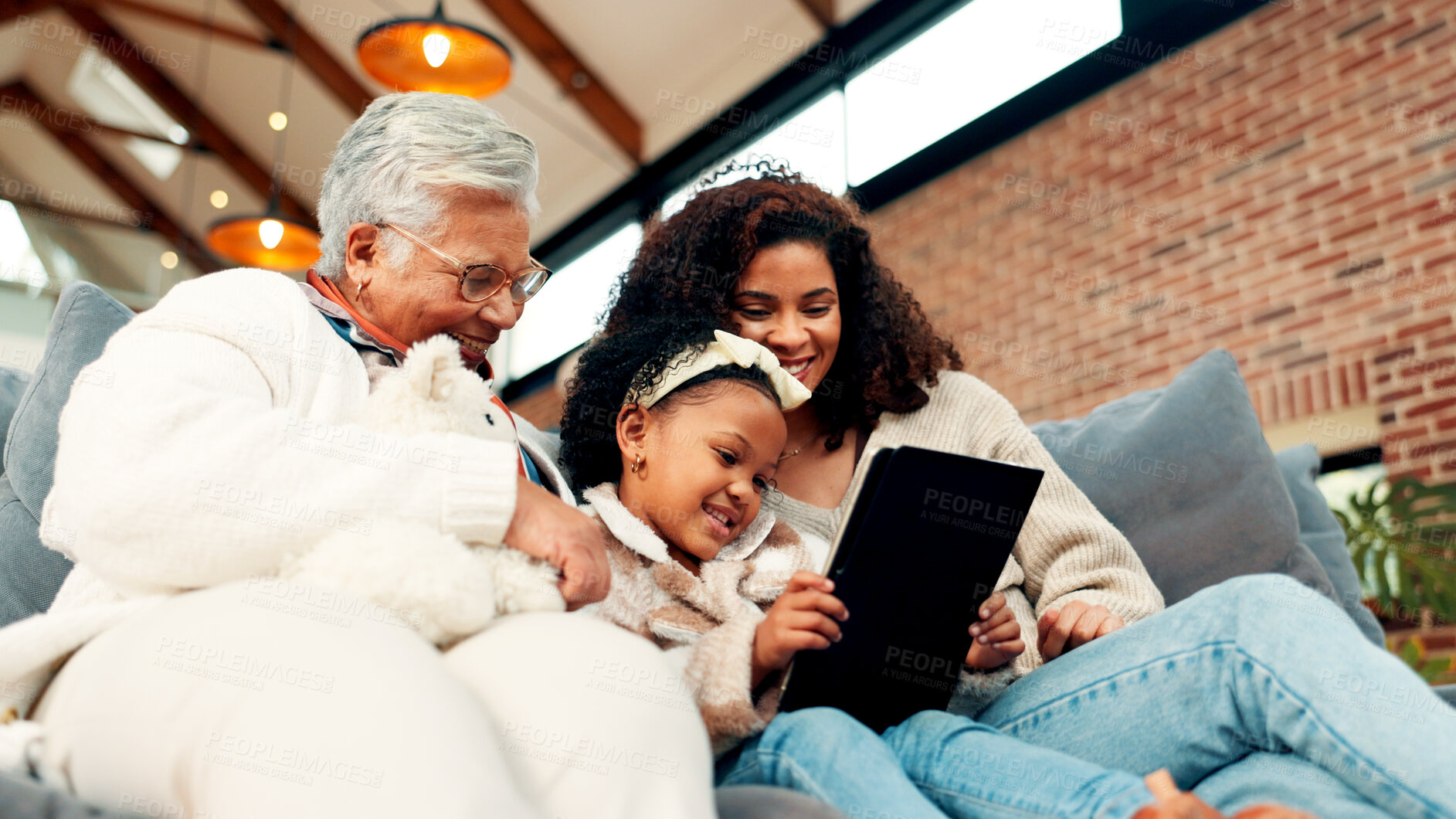Buy stock photo Mom, grandma and girl on couch with tablet, happy and low angle with movie, care and bonding. Senior woman, mother and child with app, streaming or film subscription for generations in family home