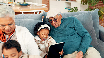 Buy stock photo Grandparents, children and relax on sofa with tablet, care and bonding with movie in living room. Senior people, kids and smile with app, streaming or film subscription on couch at family house