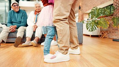 Buy stock photo Family, dance and legs of parent with child in home for bonding, learning steps and relationship. Grandparents, living room and feet of kid with dad for dancer lessons, connection and fun together