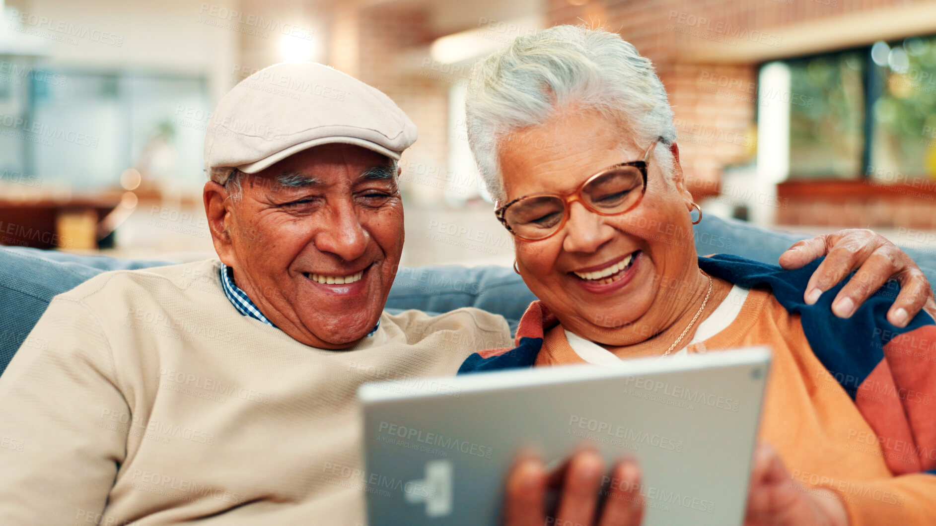 Buy stock photo Sofa, home and old couple on tablet laugh for online streaming, internet subscription or bonding. Retirement, marriage and mature man and woman on digital tech for videos, watching movie and relax