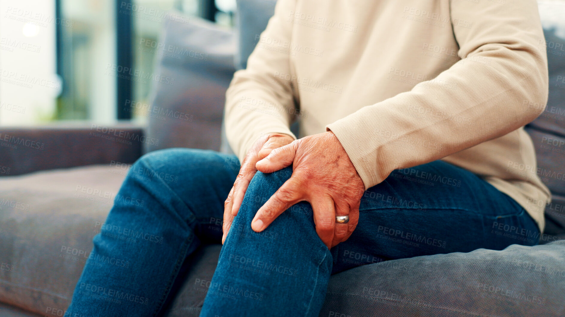Buy stock photo Knee pain, home and senior man on sofa with injury for arthritis, osteoporosis and fibromyalgia. Retirement, living room and mature person with discomfort for inflammation, joint ache and tension