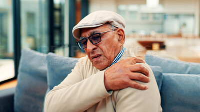 Buy stock photo Shoulder pain, home and senior man on sofa with injury for arthritis, osteoporosis and fibromyalgia. Retirement, living room and mature person with discomfort for inflammation, joint ache and tension