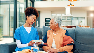 Buy stock photo Talking, pills and nurse with old woman in home for prescription, consulting or advice. Retirement, healthcare and caregiver with medicine for senior person for treatment, medical service or wellness