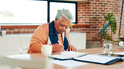 Buy stock photo Old woman, writing and documents for finance in home for insurance policy, contract or agreement. Elderly person, paperwork and form for registration, signature and tax compliance for pension funding