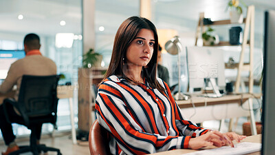 Buy stock photo Serious, employee and woman with computer, office or journalist with story for magazine and creative. Newsroom, reporter and person with technology for article publication, productivity and coworking