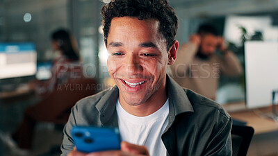 Buy stock photo Media agency, night and happy man in office, cellphone and funny meme with communication. Person, evening or journalist in workspace, smartphone or email for online review or digital app for chatting