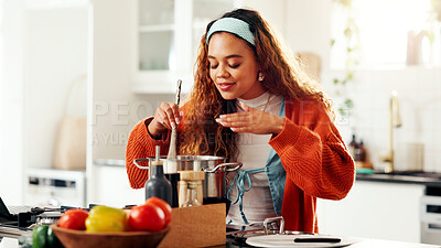 Buy stock photo Aroma, cooking and stove with woman in kitchen of home for health, organic diet or nutrition. Scent, pot and wooden spoon with person smelling food at counter in apartment for meal preparation