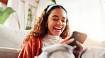 Woman, relax and laugh with phone in home for social media, reading meme and funny video. Smile, female person and mobile app for browsing website, streaming comedy and online joke for entertainment