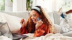 Credit card, laptop and celebration with woman on couch for online shopping, ecommerce and sale. Payment, banking website and person excited in lounge of home for deal, transaction or subscription