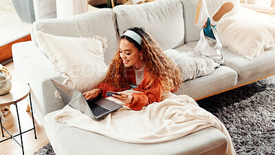 Buy stock photo Laptop, credit card and happy woman in home for online shopping, discount and typing. Debit, computer and girl in living room for ecommerce, fintech and financial transaction with payment above