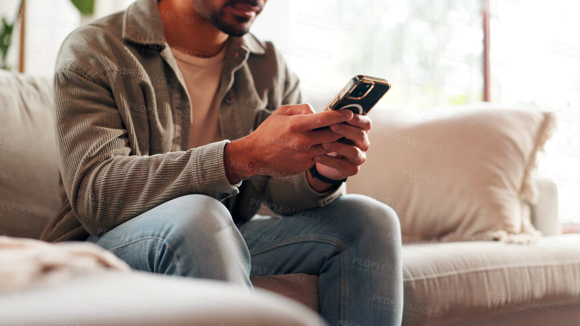 Buy stock photo Hands, mobile and man relax in home for online dating, social media profile and post. Smartphone, sofa and person in living room for communication with contact, typing text and response on internet