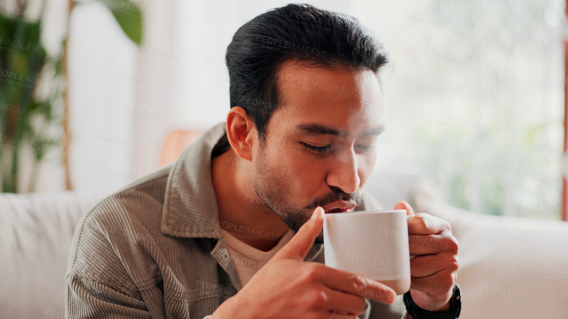 Buy stock photo Man, relax and drinking coffee at house on sofa to start day, enjoy aroma and calm morning with espresso. Male person, rest and warm beverage for breakfast, nostalgia memory and herbal tea in lounge
