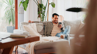 Buy stock photo Smile, cellphone and man relax in living room for online news, social media profile and post. Mobile, reading and happy person in home for communication with contact, email or watch video on internet