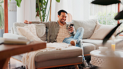 Buy stock photo Laugh, cellphone and man relax in living room for online meme, social media post and gif. Mobile, reading and happy person in home for communication with contact, joke and funny video on internet