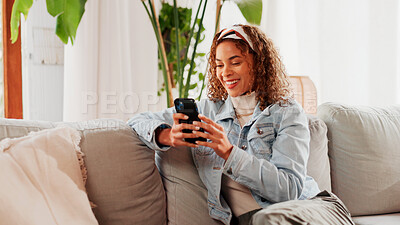 Buy stock photo Smile, smartphone and woman in home on sofa for blog post, social media profile and news. Mobile, relax and African person in living room for communication with contact, typing text or online chat