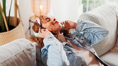 Buy stock photo Happy woman, headphones and relax on sofa with music for streaming song, album and listen to podcast. Female person, smile and audio tech for radio playlist, peace and wellness in home living room.