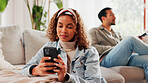Relax, woman and typing with phone on sofa for social media post, online browsing or text message. Couple, person and smartphone in home for reading ebook, streaming subscription and weekend break