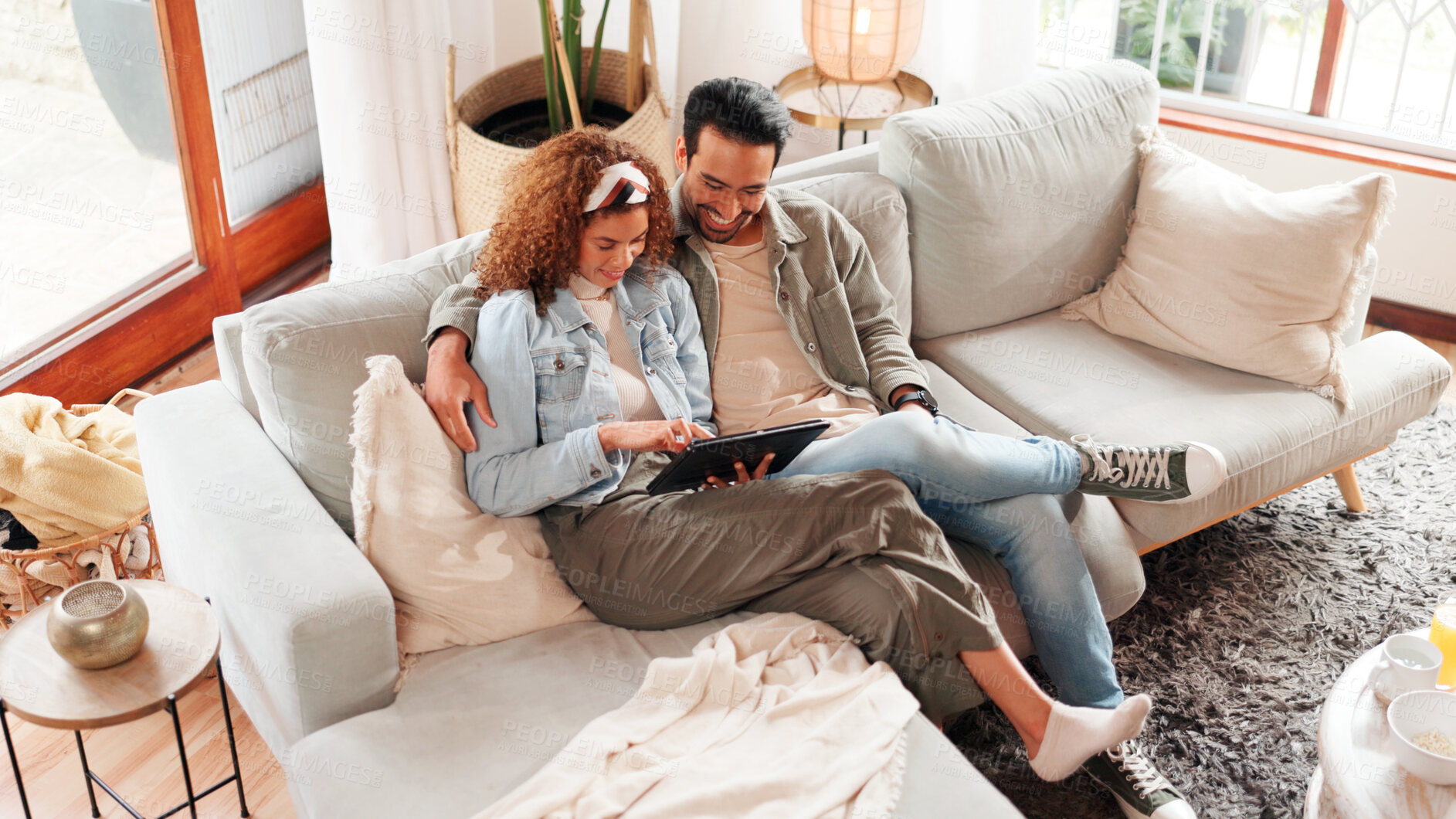 Buy stock photo Happy couple, relax or scroll on sofa with tablet for social media, online communication or connection. Above, married people or tech in home for browsing internet, bonding together and conversation.