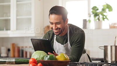 Buy stock photo Happy man, vegetables and kitchen with tablet for online tutorial or healthy recipe in home. Male person, chef and apron with smile, technology or pot for cooking tips, nutrition or food menu app