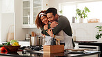 Happy couple, hug and kitchen with love for cooking food, meal prep or embrace in home. Man, woman or smile with pot, stove or vegetables for healthy recipe, support or helpful partner in house