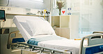 Healthcare, empty ward and bed in hospital with card, flowers and equipment for recovery. Room, healing and interior of intensive care unit for admission with furniture at medical facility or clinic.