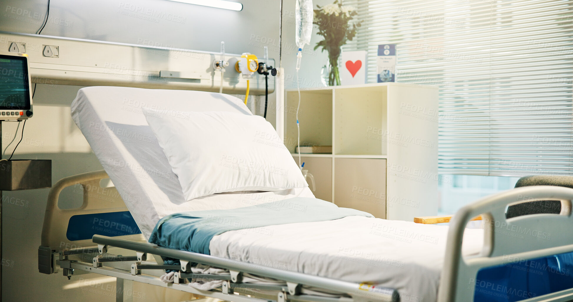 Buy stock photo Healthcare, empty ward and bed in hospital with card, flowers and equipment for recovery. Room, healing and interior of intensive care unit for admission with furniture at medical facility or clinic.