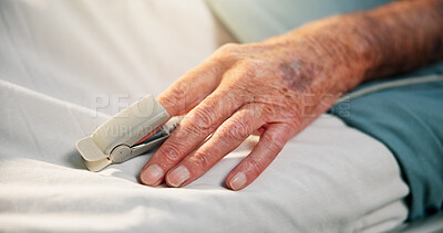 Buy stock photo Hands, sick and old person with oximeter in hospital bed to monitor pulse, blood levels and post surgery. Closeup, elderly patient or medical device to track oxygen, chronic condition and operation
