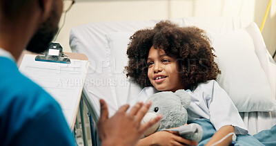 Buy stock photo Boy, doctor and teddy with clipboard in hospital bed, happy and talk with wellness report. Pediatrician, child and checklist with toy bear, assessment or smile for good news with healing at clinic