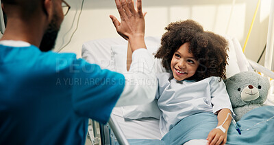Buy stock photo Boy, doctor and high five with smile in hospital bed, happy and care with support for recovery. Pediatrician, child and excited with teddy bear, motivation and celebration with healing at clinic