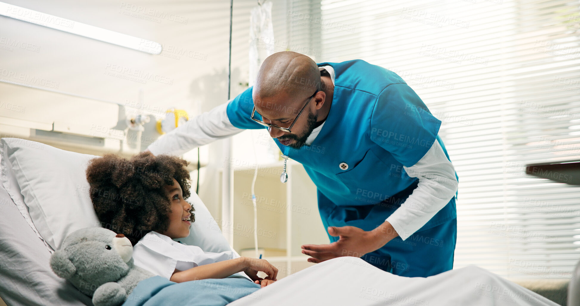 Buy stock photo Boy, doctor and happy for discussion in hospital bed, good news and care with support for recovery. Pediatrician, child and people with teddy bear, motivation and conversation for healing at clinic