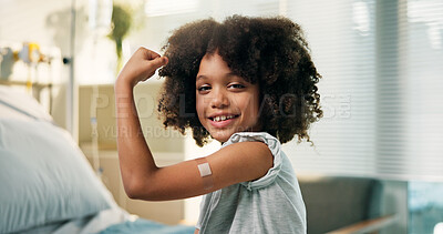 Buy stock photo Happy boy, portrait and arm with band aid for vaccine, flu shot or immunity in hospital. Child, kid or youth with smile, flex or plaster for medical vaccination, healthcare visit or cure in clinic