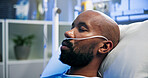 Man, breathing tubes or sleeping on hospital bed for post surgery, healthcare or recovery. Sick patient, black person or rest with nasal cannula in ICU for respiratory support, ventilation or healing