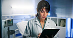 Doctor, woman and tablet for planning in hospital with reading for healthcare or consultation. Typing, support and service with person for diagnosis, medical treatment and results in night clinic