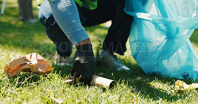 Buy stock photo Hand, volunteer and cleaning outdoor with trash bag for sustainability, conservation or ngo. Person, park or pick up garbage for community service, recycle or earth day with waste management on grass