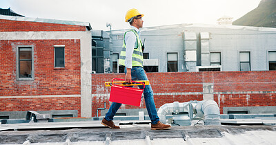 Buy stock photo Man, electrician and walk with toolbox on roof for maintenance, ac repair and installation. Male person, inspection and gear for air conditioning services, hvac troubleshooting and quality assurance