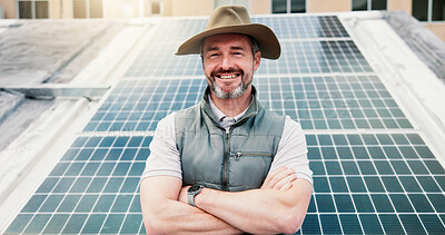 Buy stock photo Portrait, man outdoor or solar panel with arms crossed for clean energy, electricity or eco project. Happy, person or photovoltaic system in city for power supply, carbon footprint or sustainability.