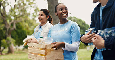 Buy stock photo Food, volunteering and people in park, help and conversation with community outreach. Donation, group or friends with discussion, NGO project or teamwork with solidarity, charity or poverty relief