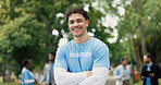 Happy man, portrait and volunteer with confidence for eco friendly development or change in nature. Male person, activist or NGO with smile or arms crossed for charity, community work or donation