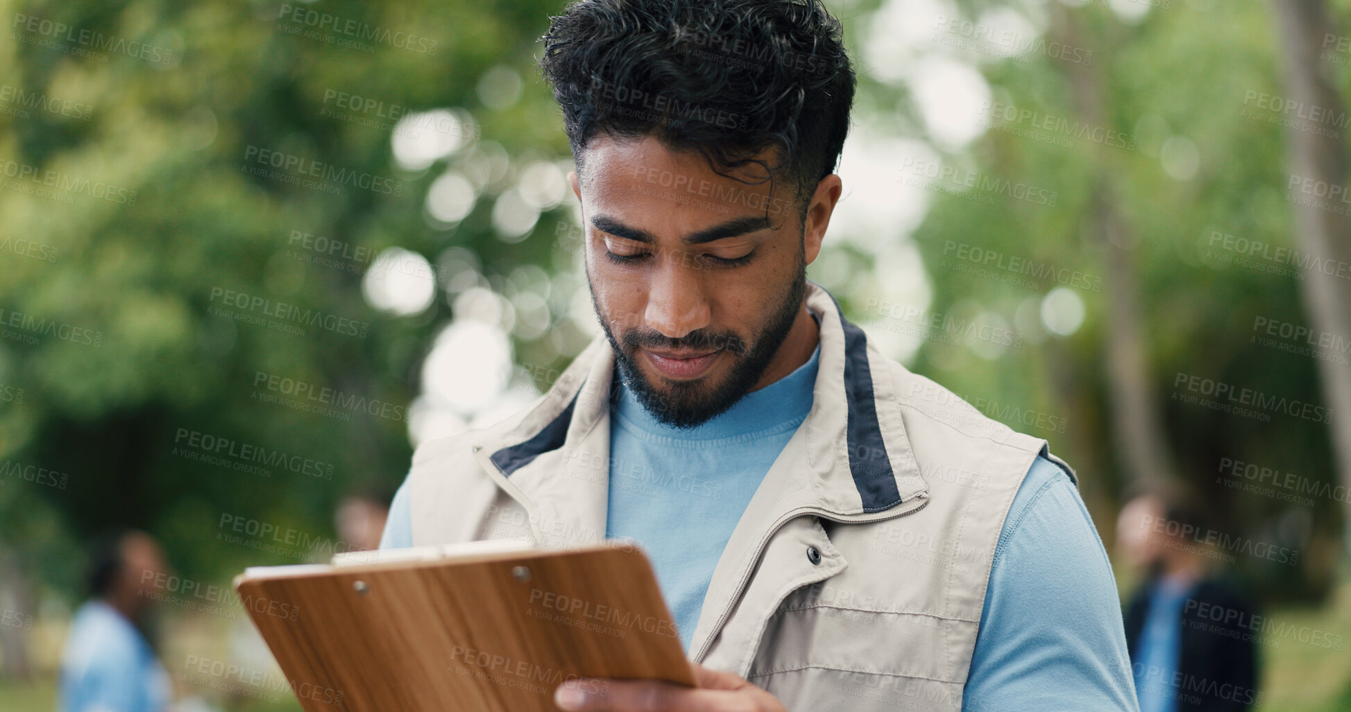 Buy stock photo Clipboard, volunteer and writing with man in park for donation, community service and ngo project. Nonprofit checklist, grocery distribution and food drive with person outdoor for outreach program