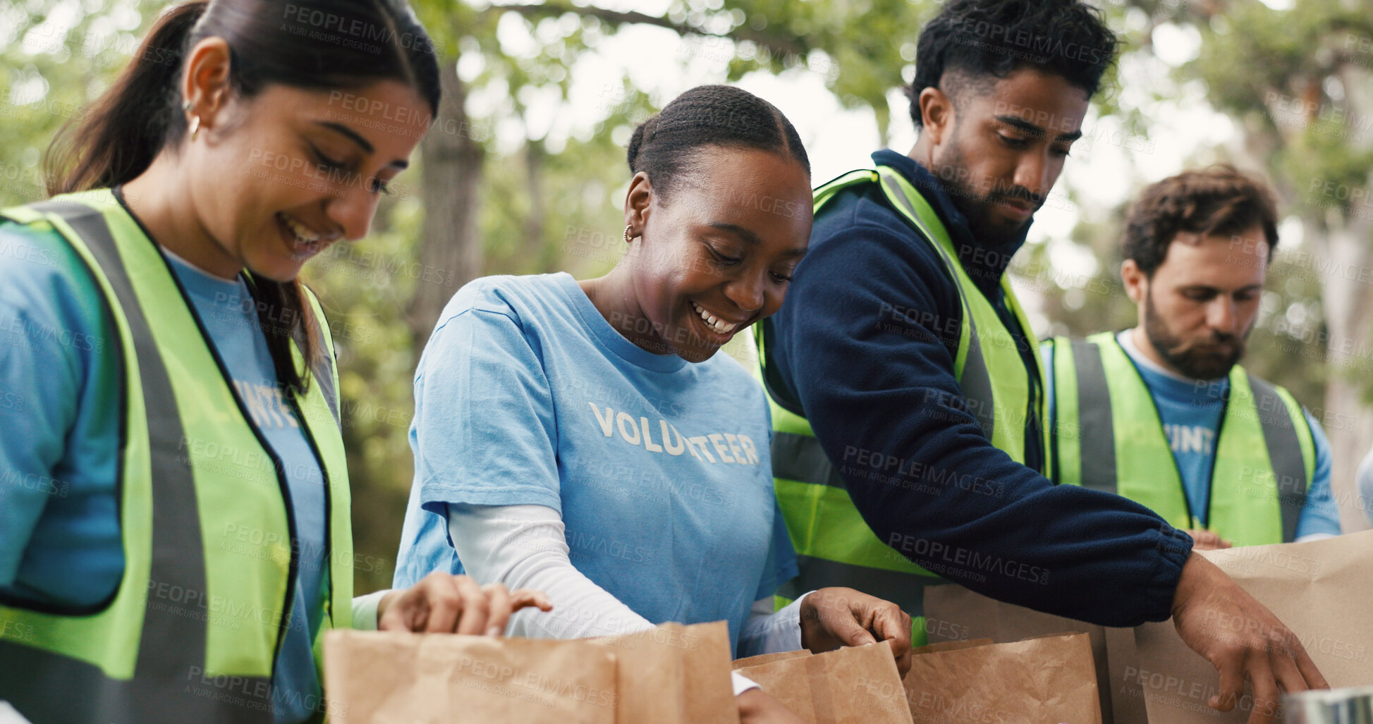 Buy stock photo Outdoor, volunteers and group with donations, charity or happy for community service with food boxes. Humanitarian, people and team with supply distribution, NGO and social responsibility in woods