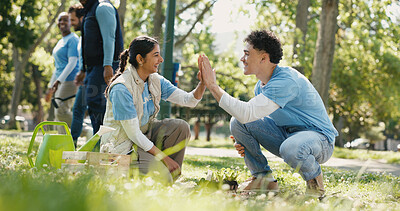 Buy stock photo People, volunteer and high five with plant at park for gardening success of community service. Smile, man and woman with teamwork for earth day, reforestation and celebration for sustainable project