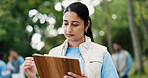 Clipboard, volunteer and writing with woman in park for donation, community service and ngo project. Nonprofit checklist, grocery distribution and food drive with person outdoor for outreach program