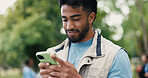 Phone, man and volunteer in nature for networking, contact or social media post for outreach. Happy, outdoor and male ngo worker with cellphone for communication with community service in park.