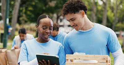 Buy stock photo Tablet, volunteer and team with people in park for donation, community service and ngo project. Nonprofit checklist, grocery distribution and food drive with man and woman with tech for charity